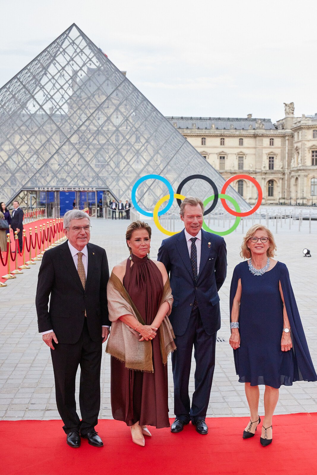 The Grand Duke and Grand Duchess of Luxembourg are greeted by Thomas and Claudia Bach as they arrive for a gala dinner hosted by the International Olympic Committee and the French Presidency at the Louvre Museum in Paris on July 25, 2024 (Cour Grand-Ducale)
