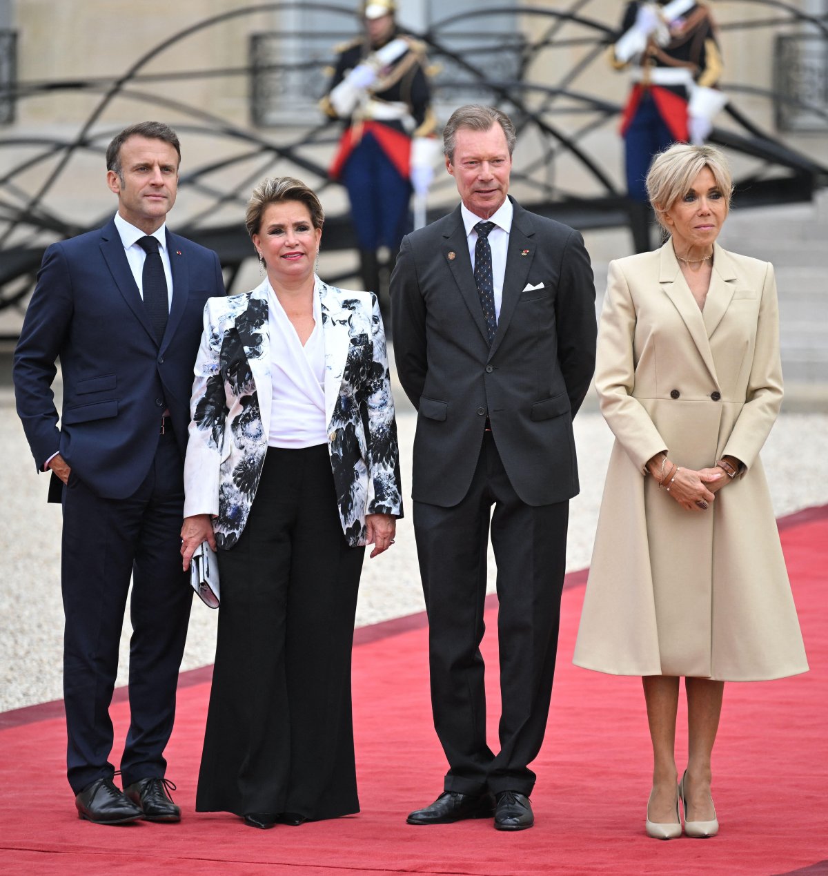 The Grand Duke and Grand Duchess of Monaco, with French President Emmanuel Macron and Brigitte Macron, attend a reception at the Élysée Palace ahead of the opening ceremony of the Summer Olympic Games in Paris on July 26, 2024 (Eliot Blondet/Abaca Press/Alamy)