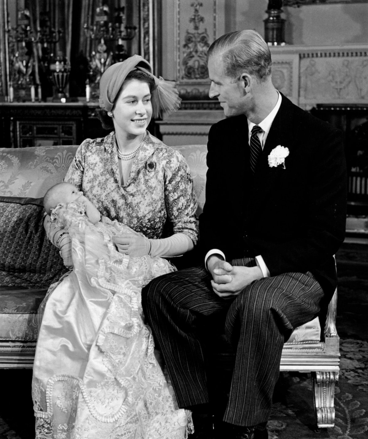 Princess Elizabeth and Prince Philip, with Princess Anne, pose for portraits after the christening of Princess Anne at Buckingham Palace on October 21, 1950 (Trinity Mirror/Mirrorpix/Alamy)
