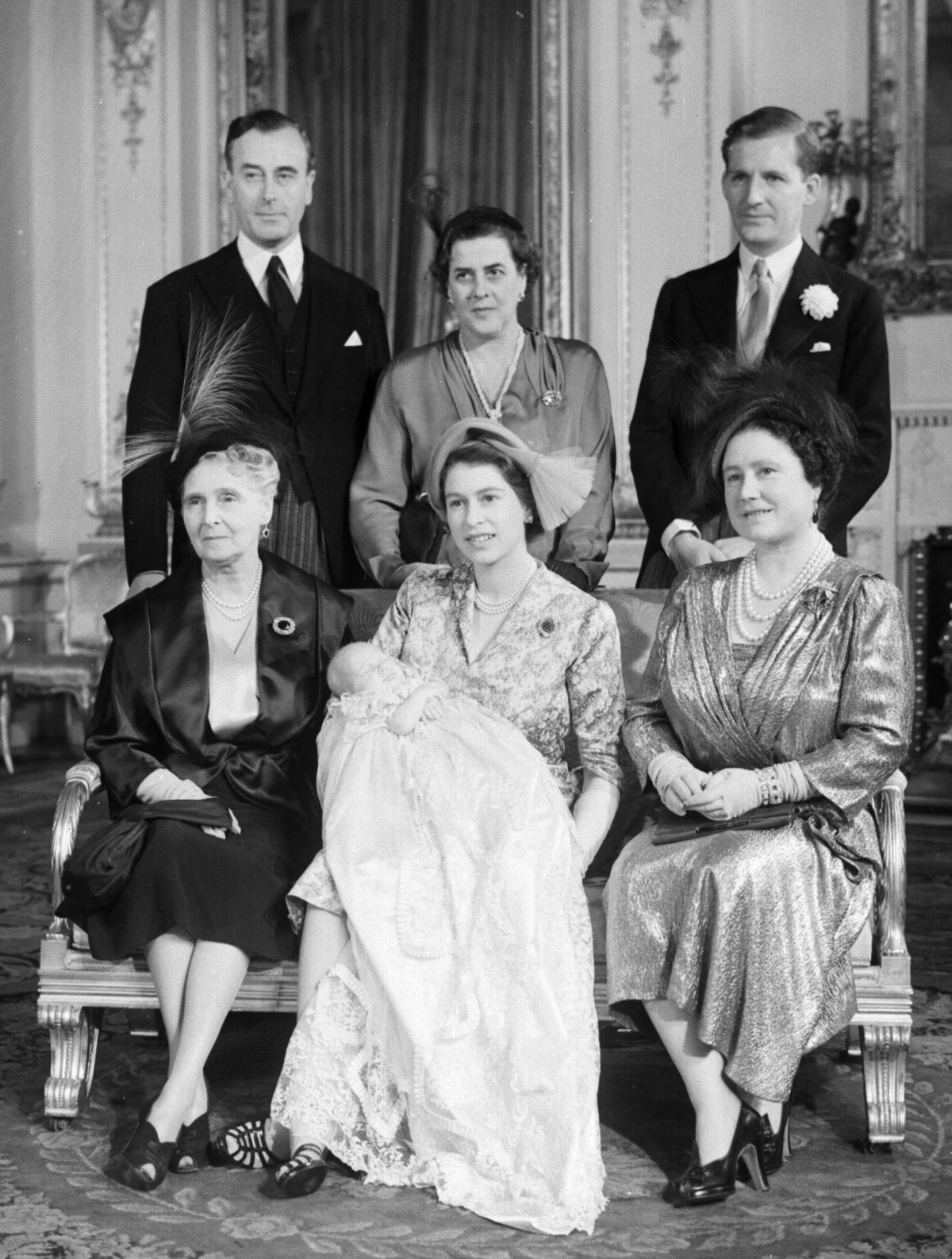 Princess Elizabeth and Princess Anne pose with the baby's godparents, Lord Mountbatten, Princess Margarita of Hohenlohe-Langenburg, Andrew Elphinstone, Queen Elizabeth, and Princess Alice, Countess of Athlone (standing proxy for Princess Andrew of Greece and Denmark) after the baby's christening at Buckingham Palace on October 21, 1950 (PA Images/Alamy)
