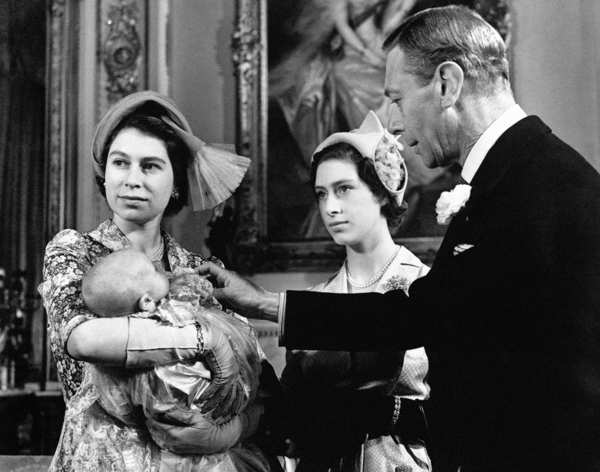 Princess Elizabeth, with Princess Anne, Princess Margaret, and King George VI, poses for portraits after the christening of Princess Anne at Buckingham Palace on October 21, 1950 (PA Images/Alamy)