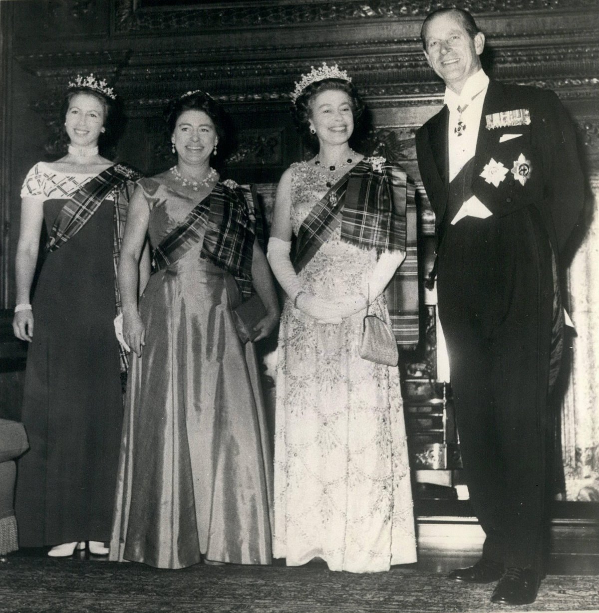 Princess Anne, Princess Margaret, Queen Elizabeth II, and Prince Philip attend the Royal Company of Archers Ball in Edinburgh on October 19, 1976 (Keystone Press/Alamy)