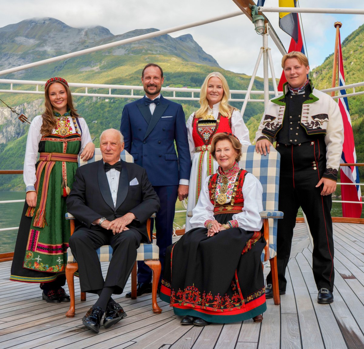 King Harald V and Queen Sonja of Norway, with Crown Prince Haakon, Crown Princess Mette-Marit, Princess Ingrid Alexandra, and Prince Sverre Magnus, pose aboard the royal yacht ahead of the wedding of Princess Martha Louise in Geiranger on August 31, 2024 (Cornelius Poppe/NTB/Alamy)
