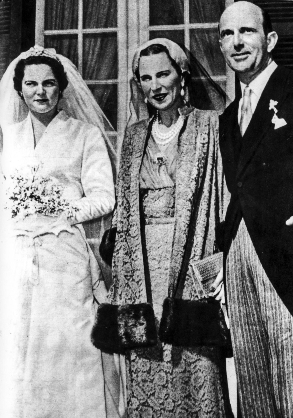 Princess Maria Pia of Savoy is pictured with her parents, King Umberto and Queen Marie-José, on her wedding day in Cascais on February 12, 1955 (Universal Images Group/Alamy)