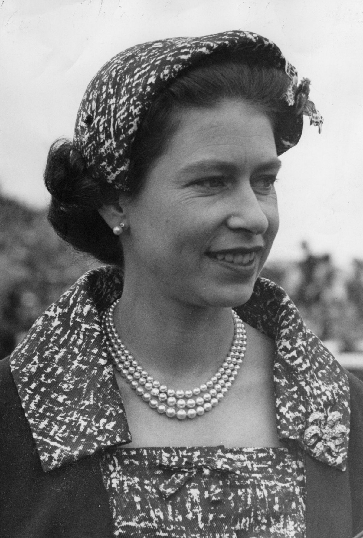 Queen Elizabeth II is pictured during the races at Goodwood, July 1958 (PA Images/Alamy)