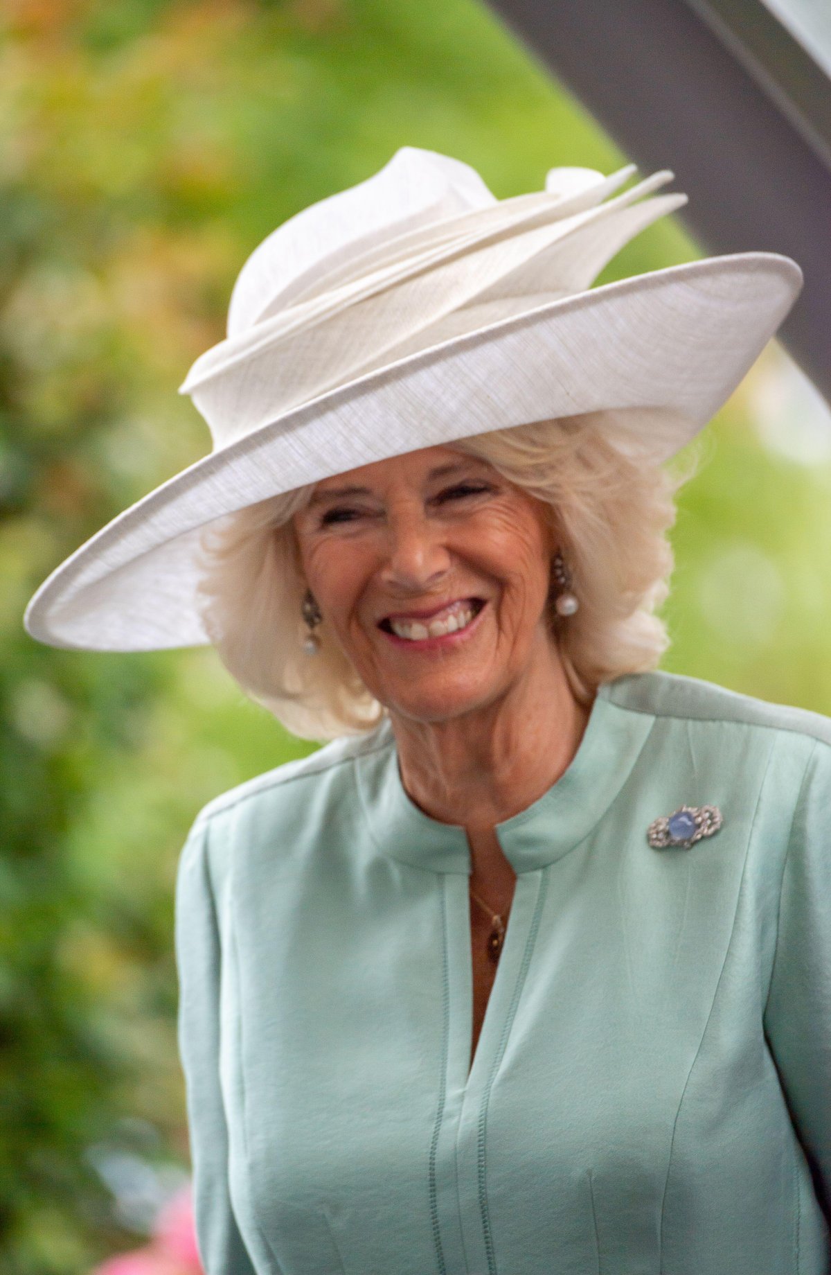 The Duchess of Cornwall presents a trophy to the winners of the King George VI and Queen Elizabeth QIPCO Stakes at Ascot Racecourse on July 23, 2022 (Maureen McLean/Alamy)