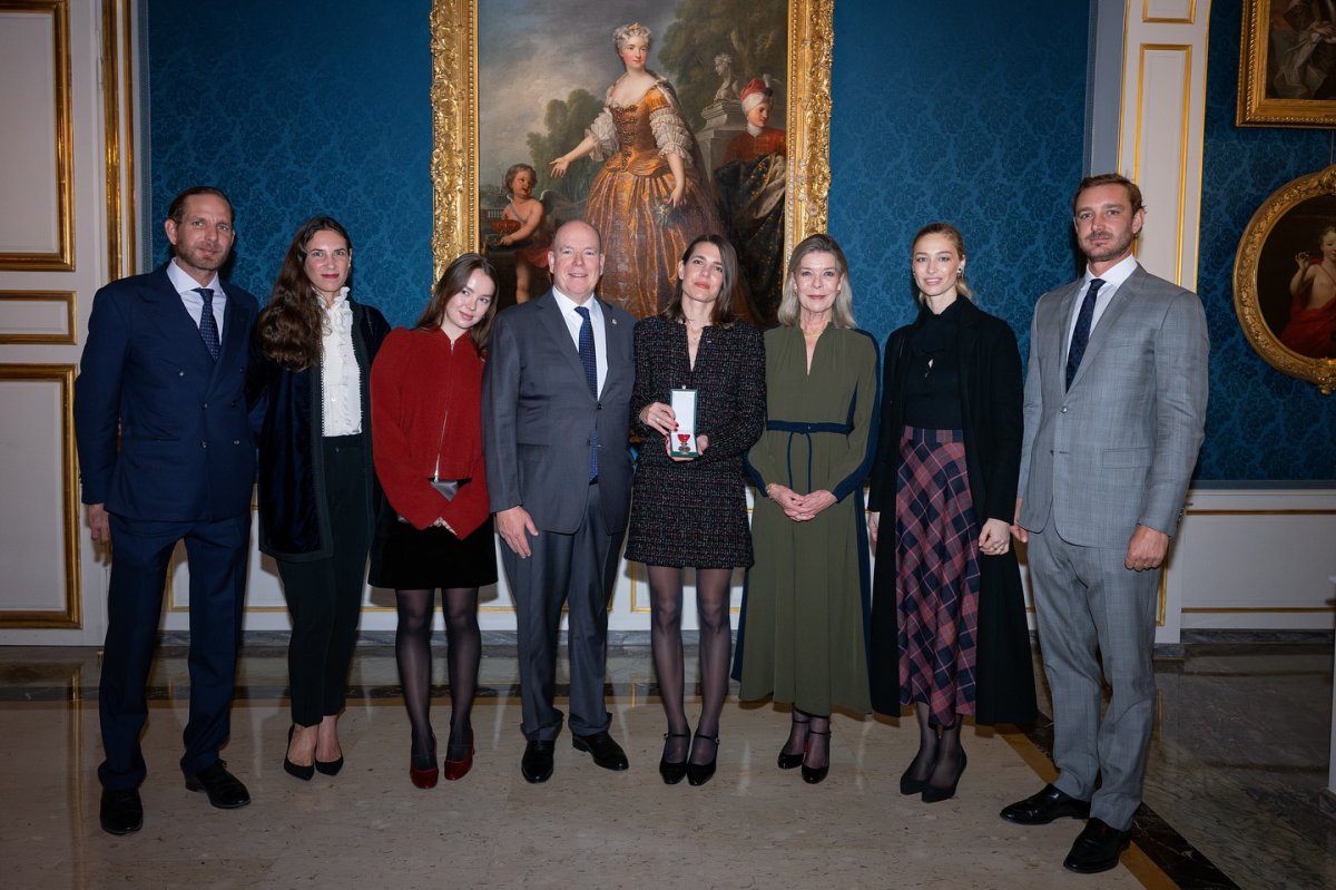 The Prince of Monaco and the Princess of Hanover pose with Charlotte Casiraghi, as well as her brothers, sister, and sisters-in-law, after Charlotte's installment as a Knight in the Order of Cultural Merit on November 18, 2024 (Palais Princier de Monaco)