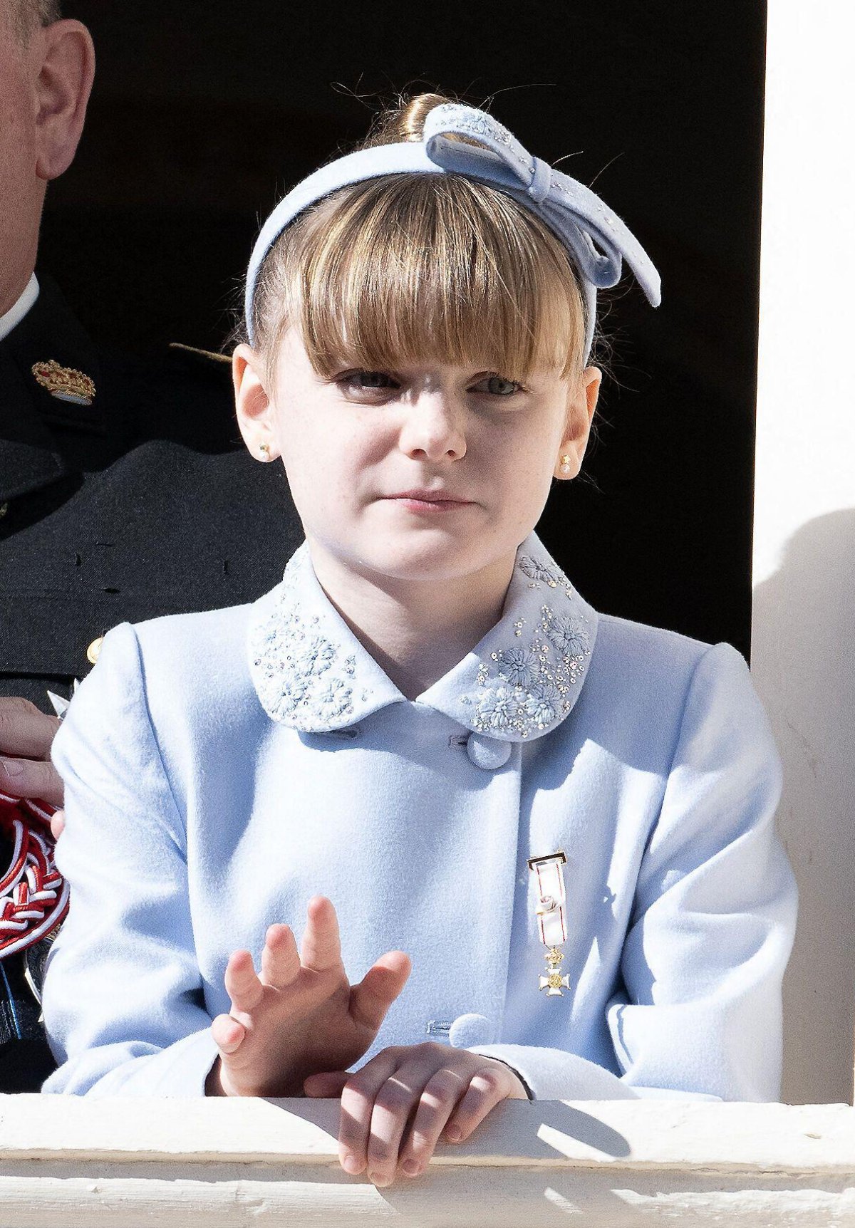 Princess Gabriella of Monaco watches a military ceremony from a palace balcony during the celebrations of Monaco's National Day on November 19, 2024 (David Niviere/Abaca Press/Alamy)