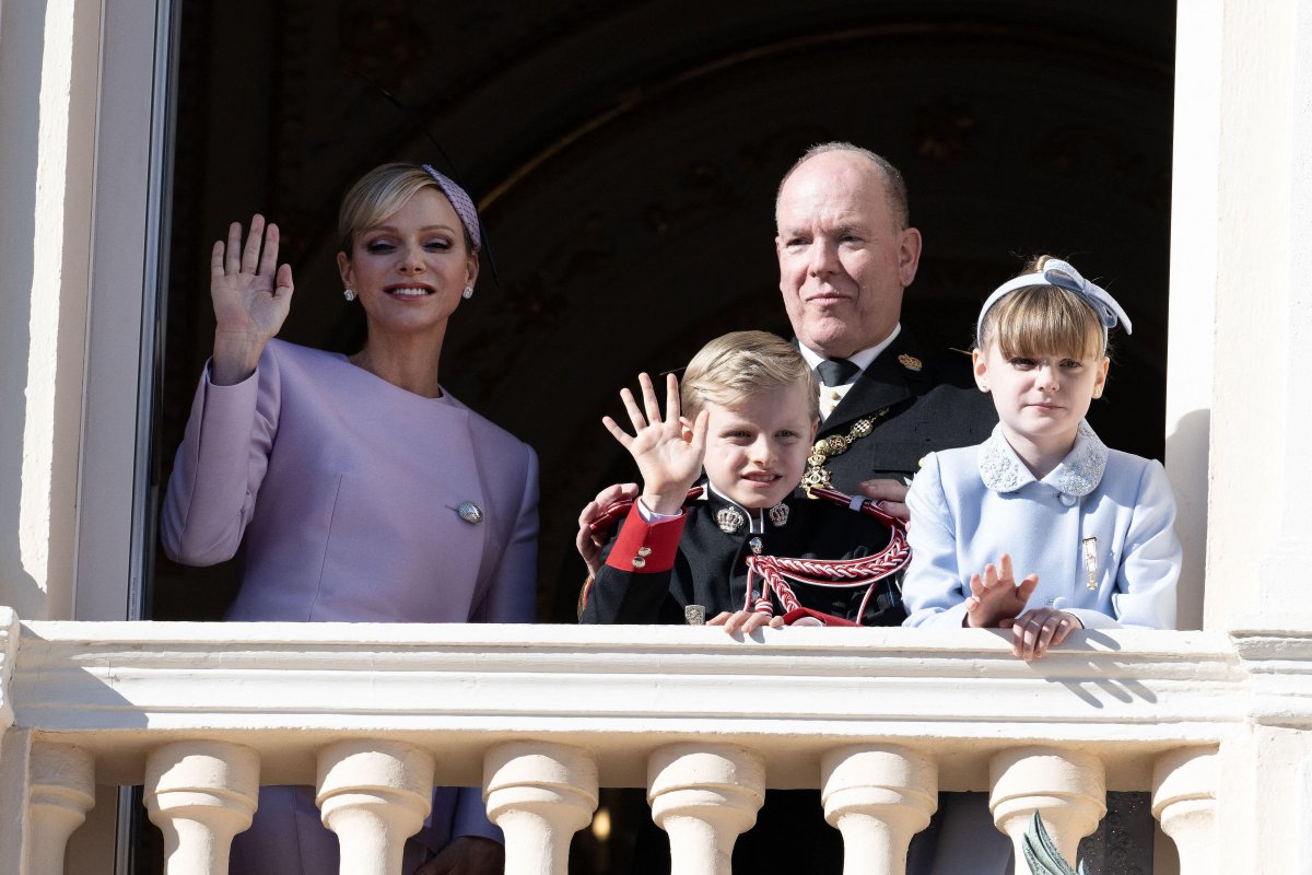 The Prince and Princess of Monaco, with Hereditary Prince Jacques and Princess Gabriella, wave to the public from a palace balcony during the celebrations of Monaco's National Day on November 19, 2024 (David Niviere/Abaca Press/Alamy)