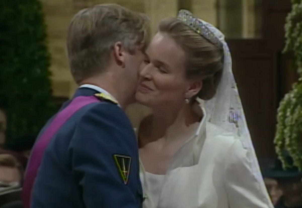 The Duke and Duchess of Brabant kiss during their wedding ceremony in Brussels on December 4, 1999 (screencapture)