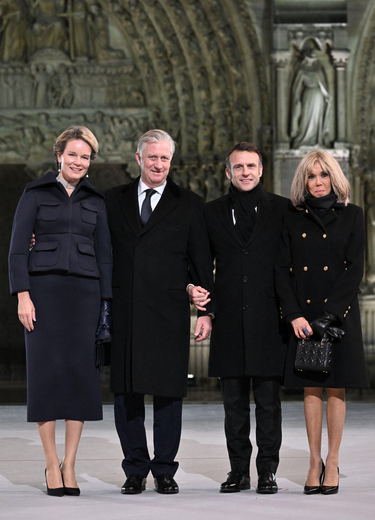 The King and Queen of the Belgians pose with President Emmanuel Macron and Brigitte Macron during the reopening ceremony for the Cathedral of Notre Dame in Paris on December 7, 2024 (Eliot Blondet/Abaca Press/Alamy)
