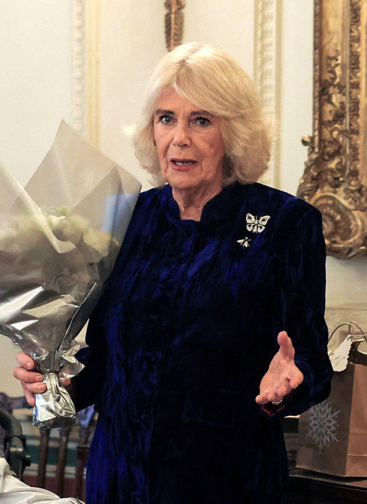 Queen Camilla hosts a Christmas party at Clarence House in London for parents and children supported by Helen & Douglas House and Roald Dahl's Marvellous Children's Charity on December 12, 2024 (Mina Kim/PA Images/Alamy)