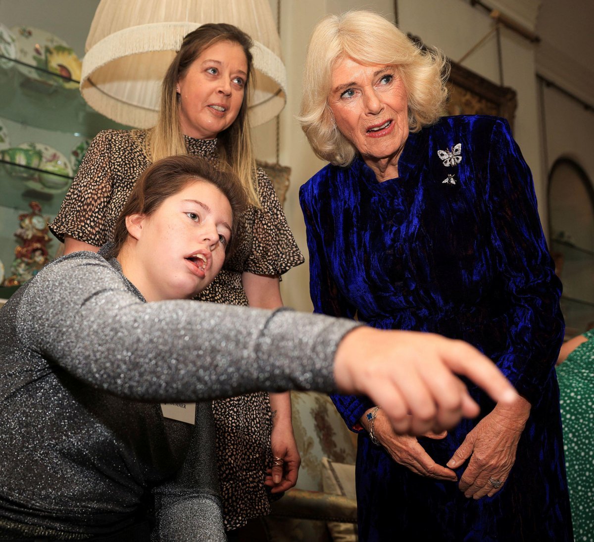 Queen Camilla hosts a Christmas party at Clarence House in London for parents and children supported by Helen & Douglas House and Roald Dahl's Marvellous Children's Charity on December 12, 2024 (Mina Kim/PA Images/Alamy)
