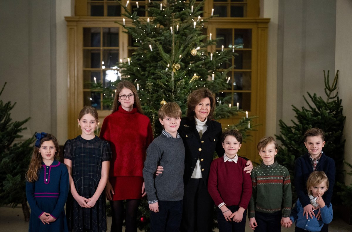 The Queen of Sweden and her grandchildren receive this year's Christmas trees at the Royal Palace in Stockholm on December 16, 2024 (Pontus Lundahl/TT News Agency/Alamy)