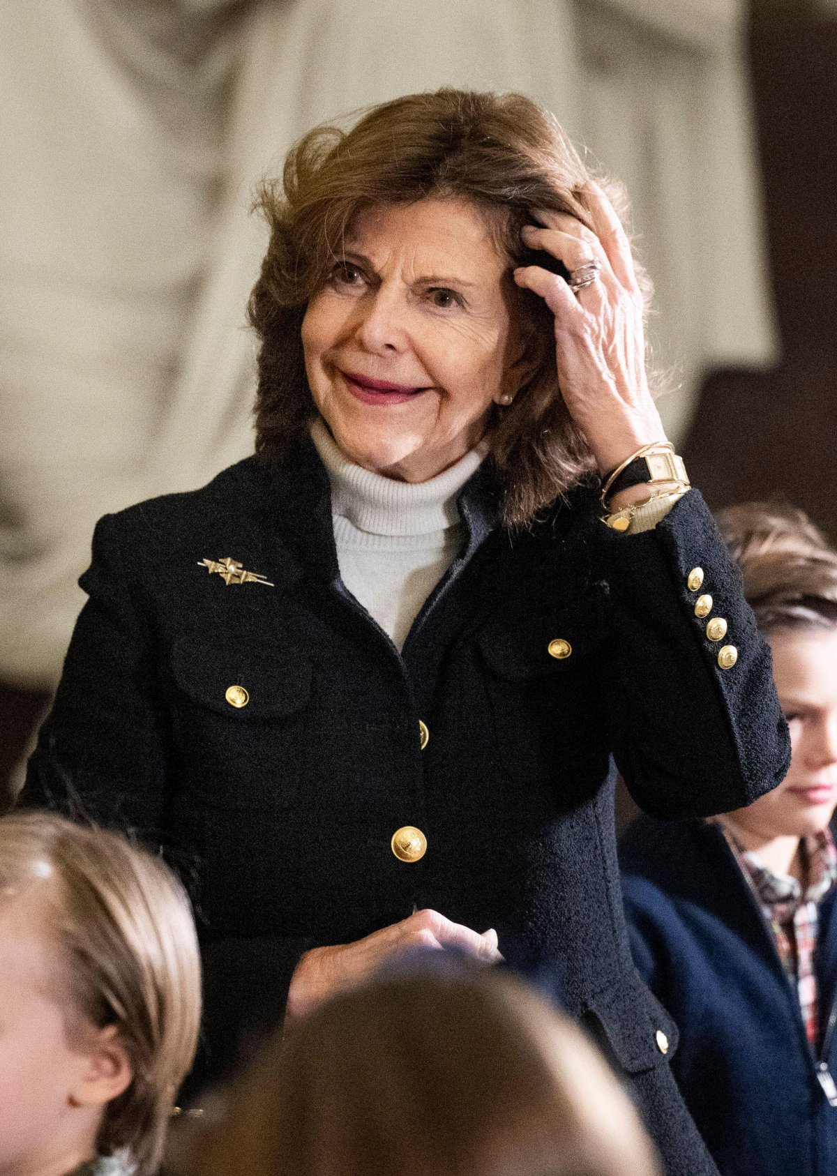 The Queen of Sweden and her grandchildren receive this year's Christmas trees at the Royal Palace in Stockholm on December 16, 2024 (Pontus Lundahl/TT News Agency/Alamy)