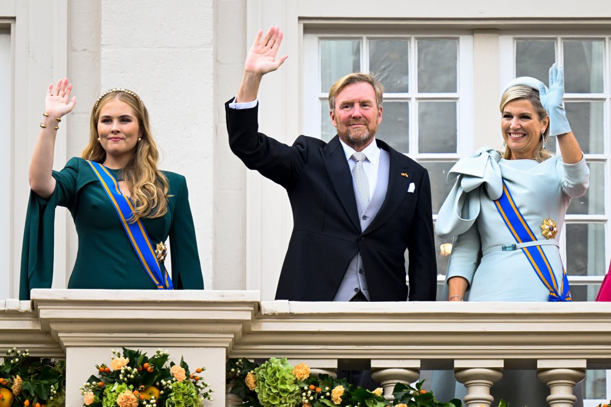 The King and Queen of the Netherlands, with the Princess of Orange, wave from the balcony of Noordeinde Palace on Prinsjesdag in The Hague on September 17, 2024 (Patrick van Emst/NLBeeld/Alamy)