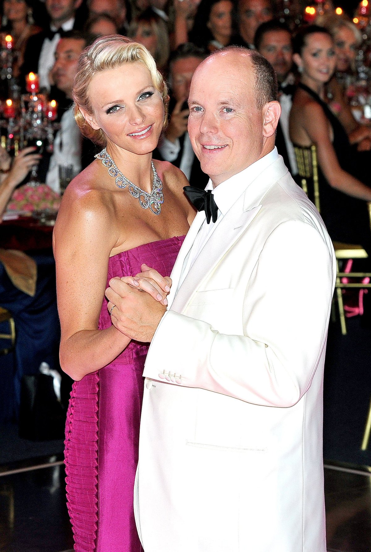 The Prince and Princess of Monaco dance during the 63rd annual Red Cross Gala on August 5, 2011 (WENN/Alamy)