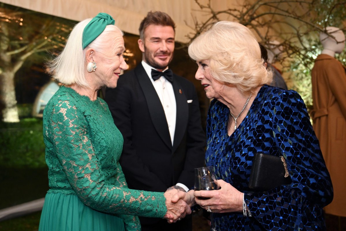 Queen Camilla greets Dame Helen Mirren and David and Victoria Beckham at a dinner in celebration of Slow Food at King Charles III's Gloucestershire estate, Highgrove House, on February 7, 2025 (Finnbarr Webster/PA Images/Alamy)