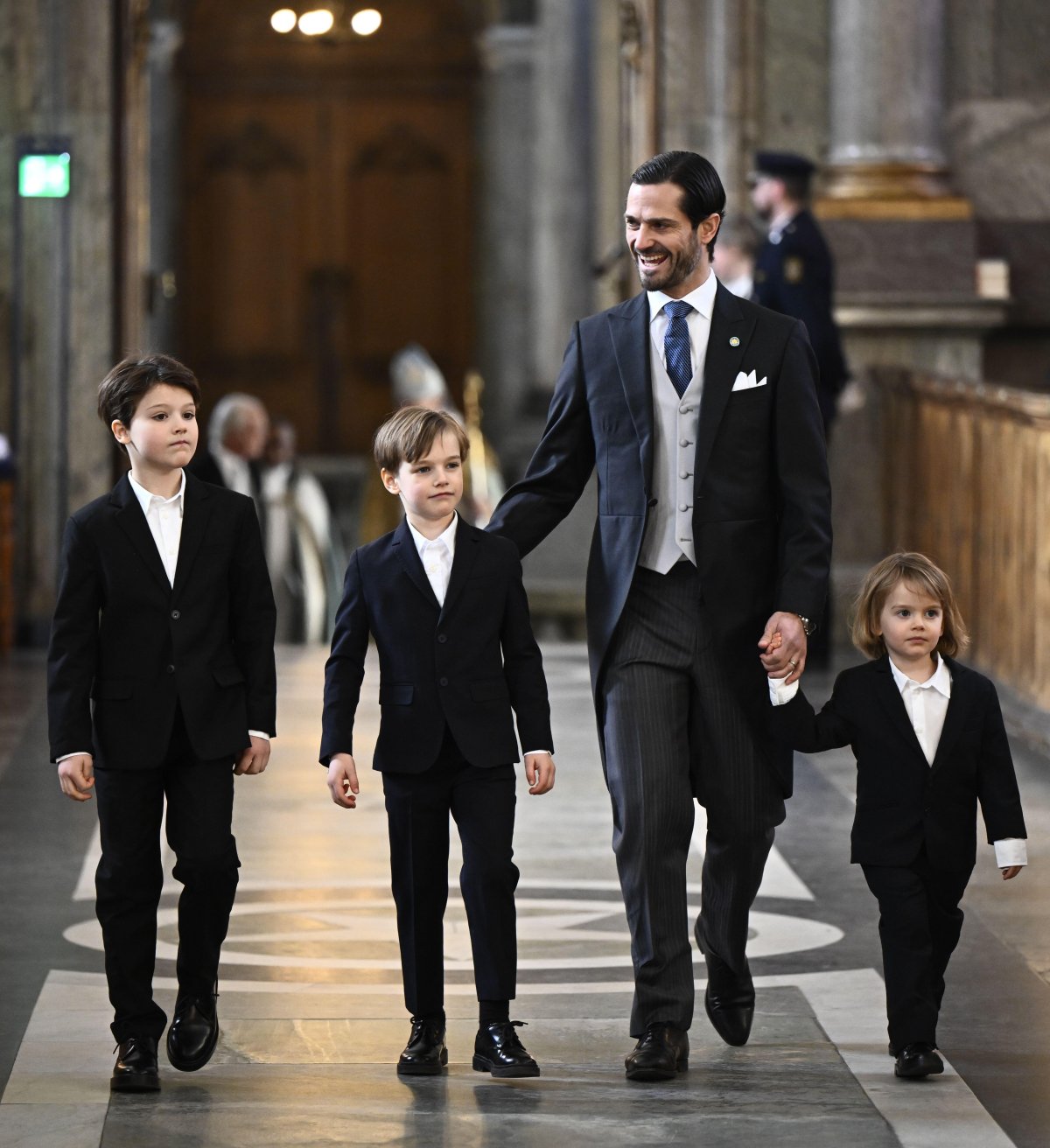 Prince Carl Philip of Sweden, with Prince Alexander, Prince Gabriel, and Prince Julian, attends a Te Deum service in honor of the birth of Princess Ines in the chapel of the Royal Palace in Stockholm on February 10, 2025 (Christine Olsson/TT News Agency/Alamy)