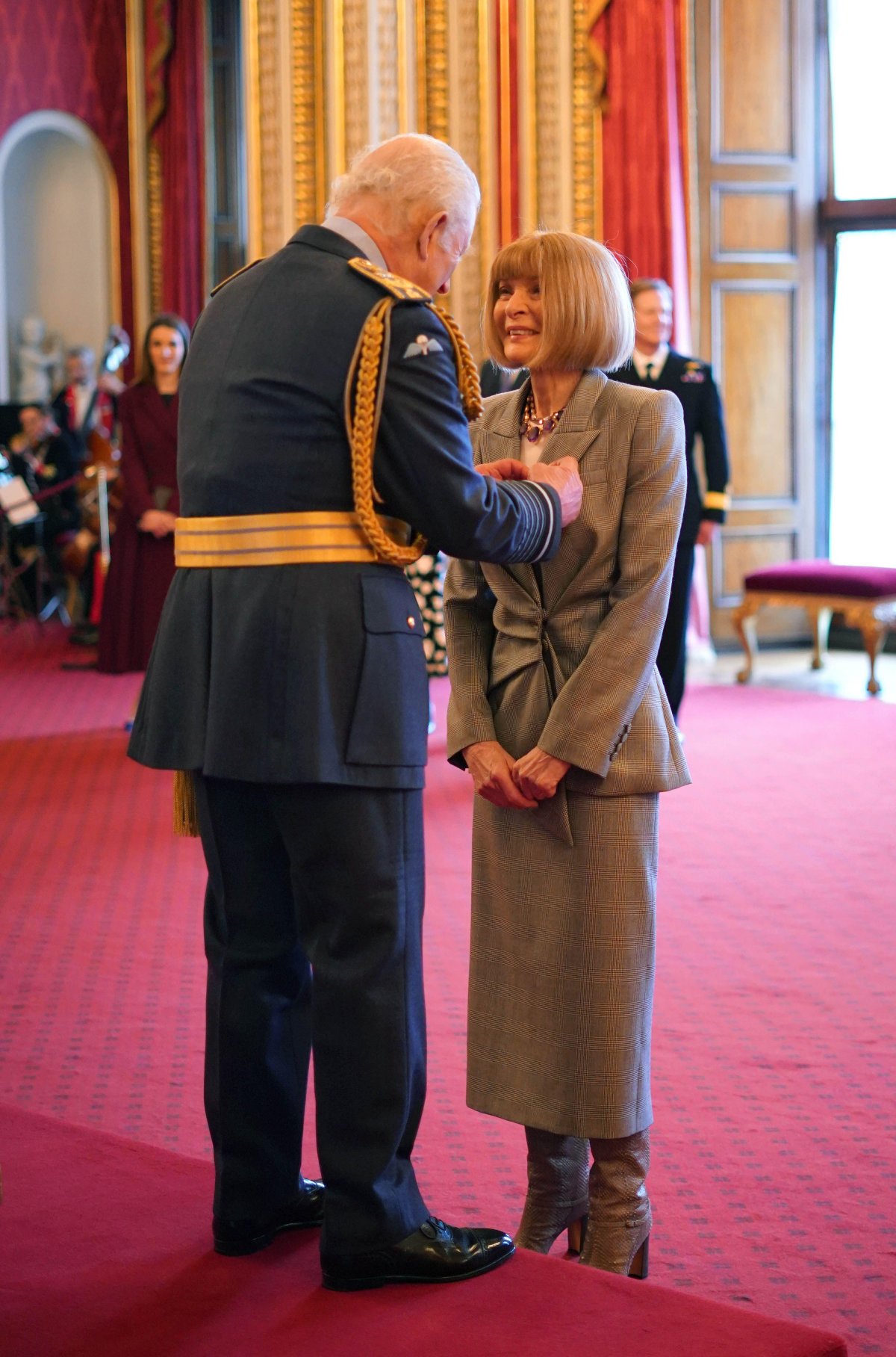 King Charles III invests Dame Anna Wintour as a Companion of Honour at Buckingham Palace in London on February 4, 2025 (Jordan Pettitt/PA Images/Alamy)