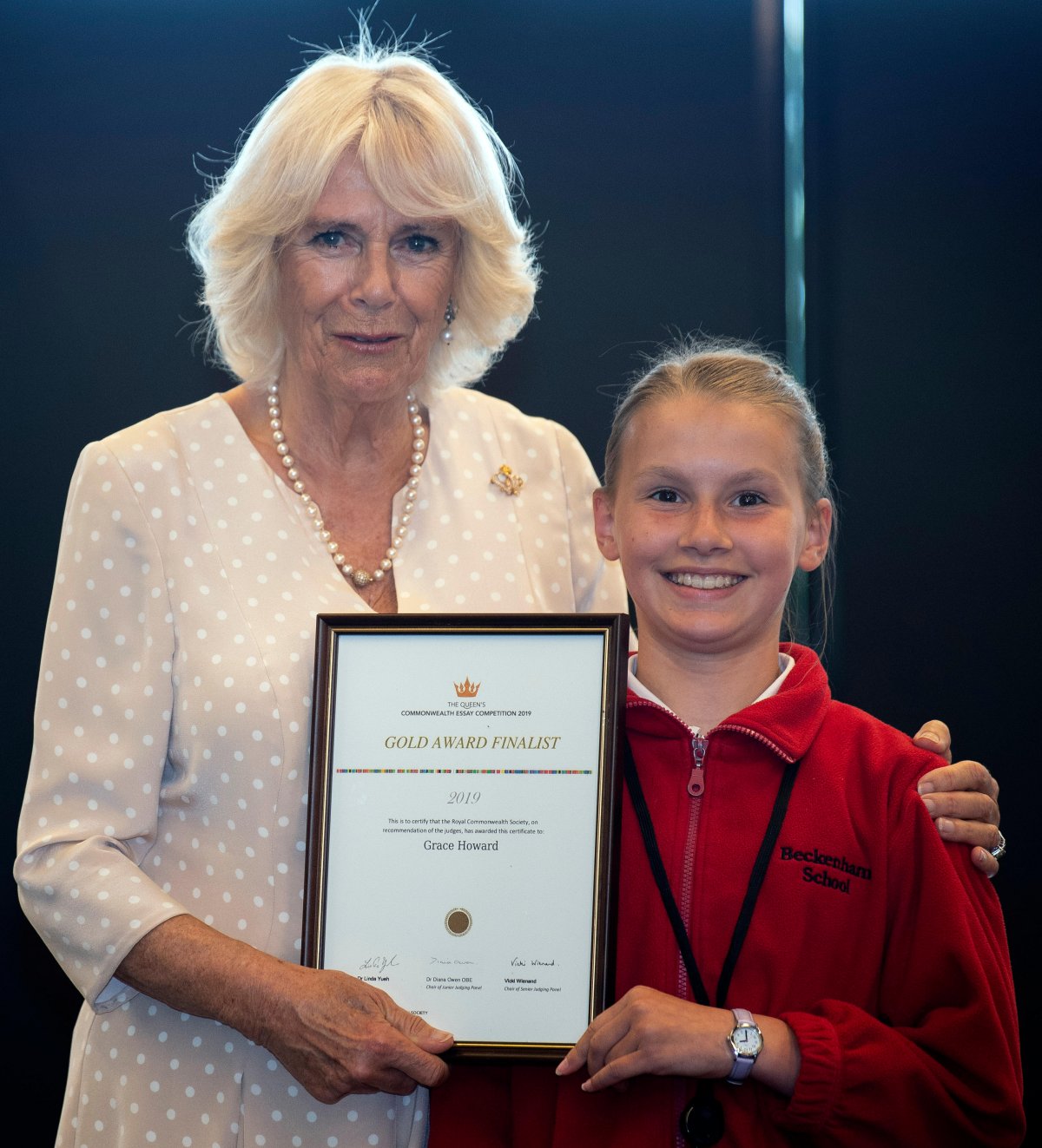 The Duchess of Cornwall poses with Grace Howard, one of the finalists in the Queen's Commonwealth Essay Competition, at Turanga Library in New Zealand on November 22, 2019 (Victoria Jones/PA Images/Alamy)