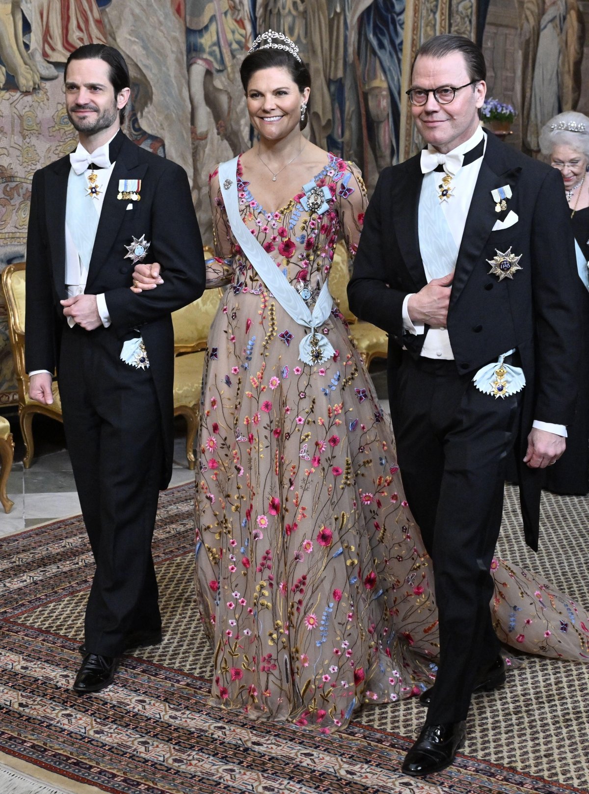 The Crown Princess of Sweden, with Prince Daniel and Prince Carl Philip, attends a representation dinner at the Royal Palace in Stockholm on March 19, 2025 (Jonas Ekströmer/TT News Agency/Alamy)