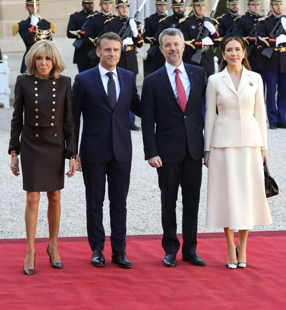 The King and Queen of Denmark are greeted by President Emmanuel Macron and Brigitte Macron at the Elysee Palace in Paris on the first day of their state visit to France, March 31, 2025 (François Loock/Alamy)