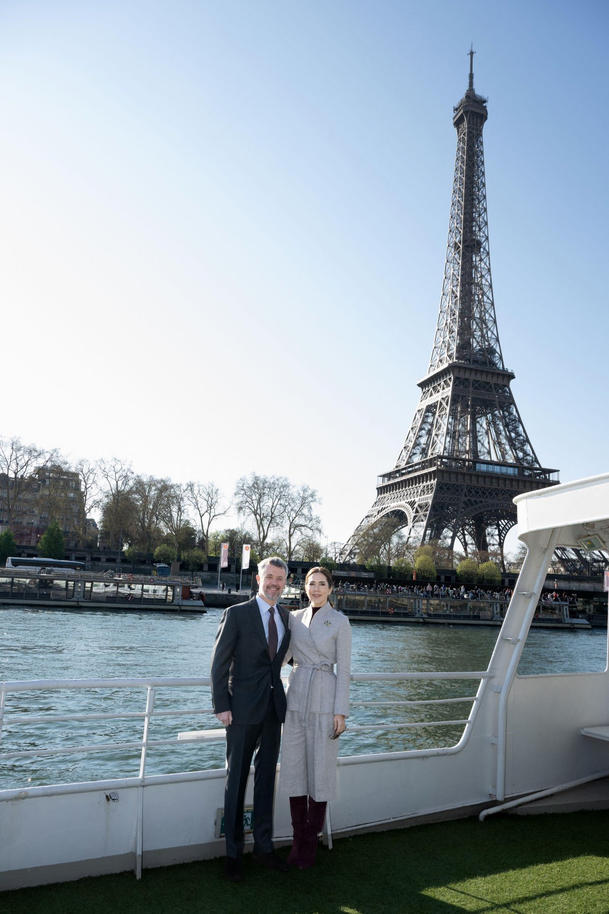 The King and Queen of Denmark pose in front of the Eiffel Tower during a boat cruise on the Seine in Paris on April 2, 2025 (David Niviere/Abaca Press/Alamy)