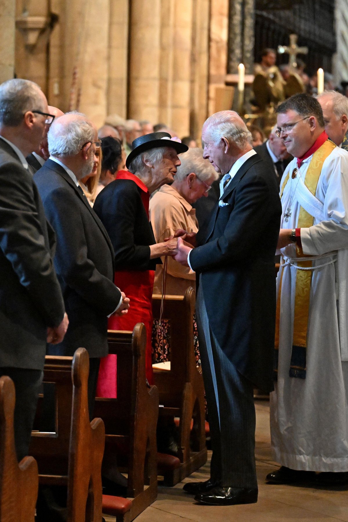 King Charles III distributes Maundy money during the Royal Maundy service at Durham Cathedral on April 17, 2025 (Anthony Devlin/PA Images/Alamy)