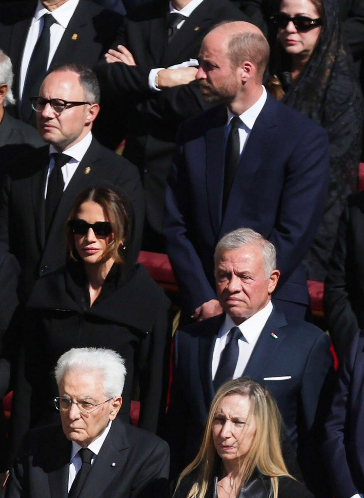 The King and Queen of Jordan (with the Prince of Wales behind them) attend the funeral of Pope Francis in St. Peter's Square at the Vatican on April 26, 2025 (IPA/Alamy)
