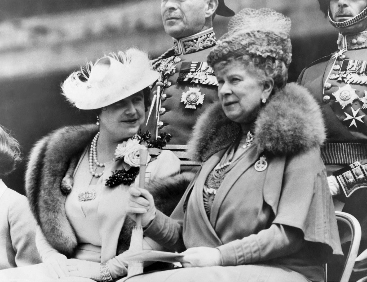 Queen Elizabeth and Queen Mary watch as King George VI presents new colors to the 2nd Battalion Grenadier Guards at Buckingham Palace in London on May 25, 1938 (Underwood Archives/Alamy)