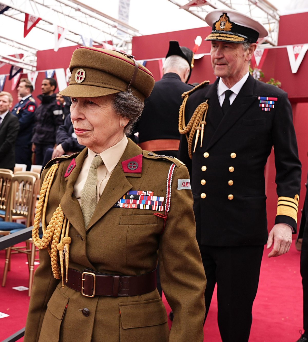 The Princess Royal and Vice Admiral Sir Timothy Laurence arrive for the military procession for the 80th anniversary of VE Day, in honor of those who served during the Second World War, at Buckingham Palace in London on May 5, 2025 (Aaron Chown/PA Images/Alamy)