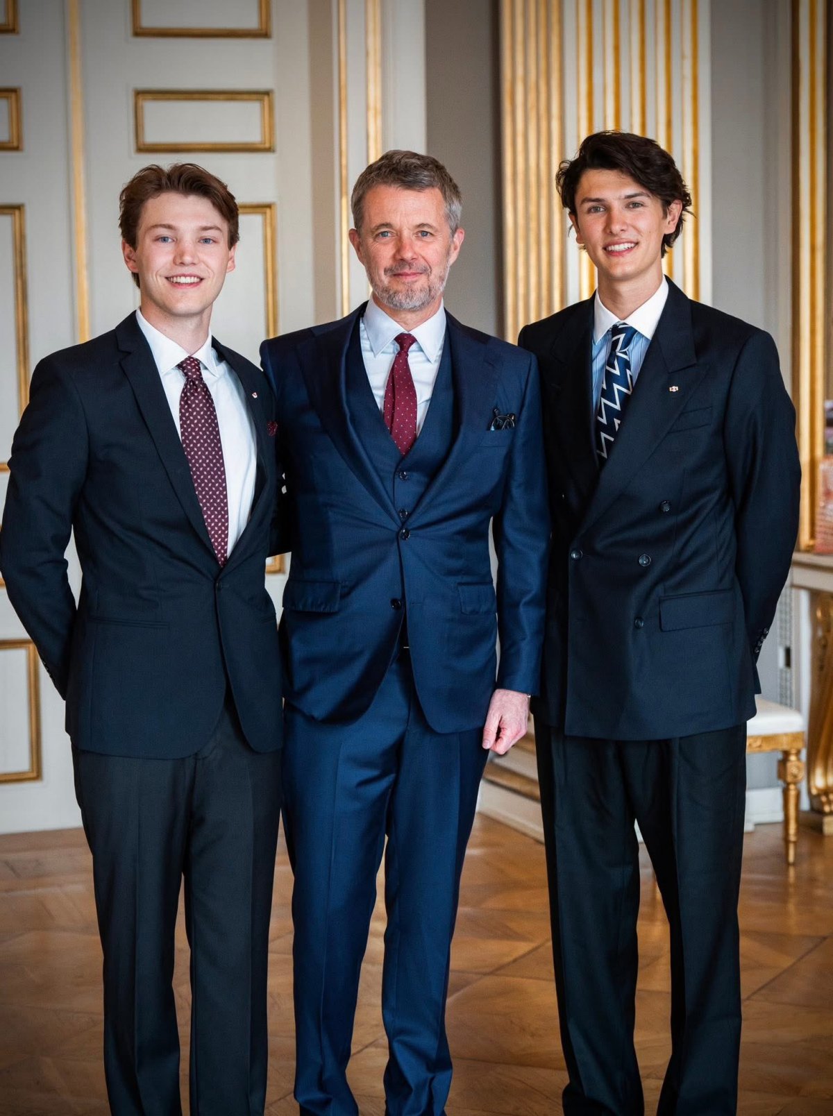 The King of Denmark presents the Grand Cross of the Order of Dannebrog to his nephews, Count Nikolai and Count Felix, in Copenhagen on May 26, 2025 (Kongehuset)