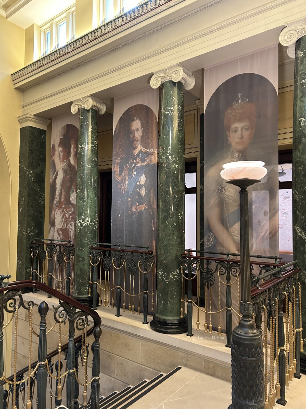 Royal portraits line the staircase of the King's Gallery, Buckingham Palace in London, April 2025 (Photo © Lauren Kiehna)