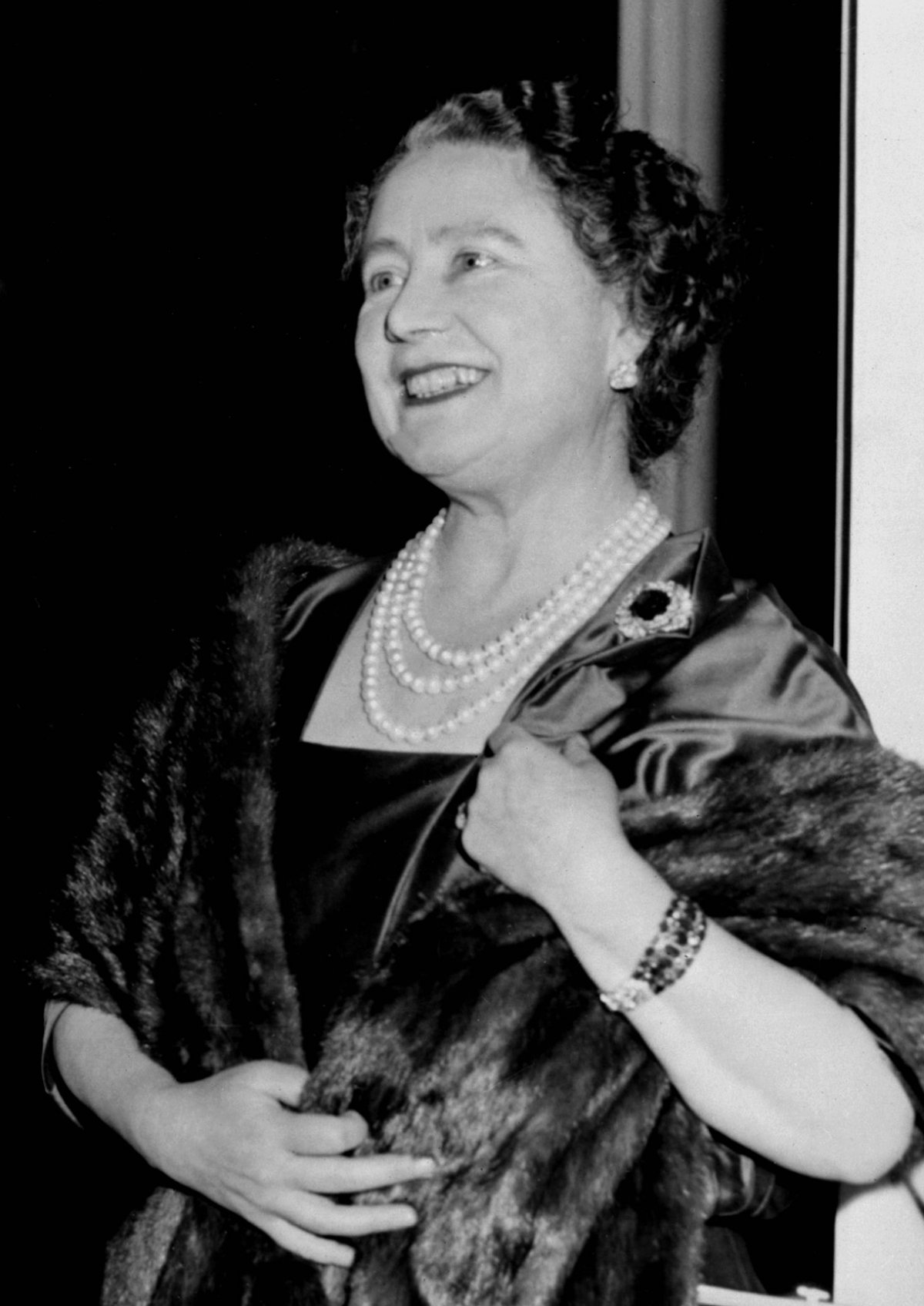 The Queen Mother beams as her newborn grandson, Viscount Linley appears before photographers with his parents at Clarence House in London, December 1961 (CENTRAL PRESS/AFP via Getty Images)