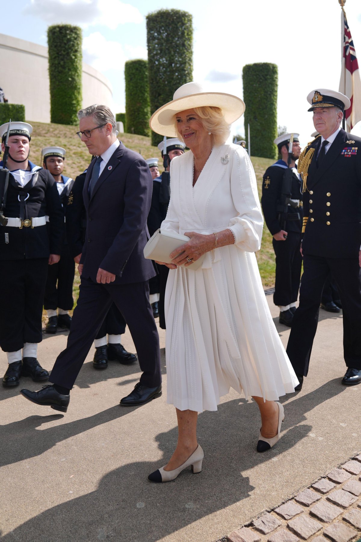 Queen Camilla and Sir Keir Starmer arrive for a service of remembrance to mark the 80th anniversary of VJ Day at the National Memorial Arboretum in Staffordshire on August 15, 2025 (Joe Giddens/PA Images/Alamy)