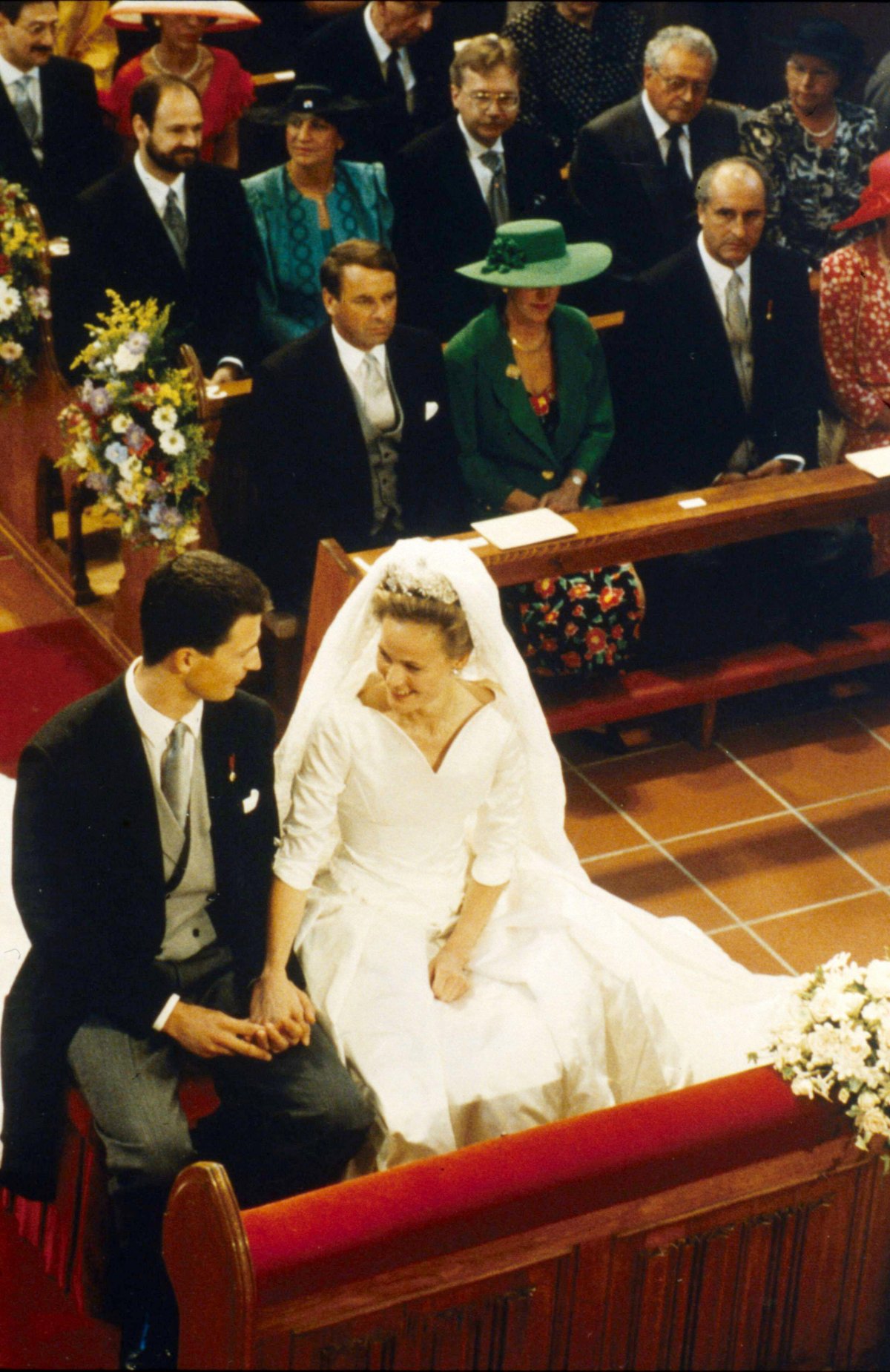 Hereditary Prince Alois of Liechtenstein and Duchess Sophie in Bavaria hold hands during their wedding ceremony in Vaduz on July 3, 1993 (LaPresse/Alamy)