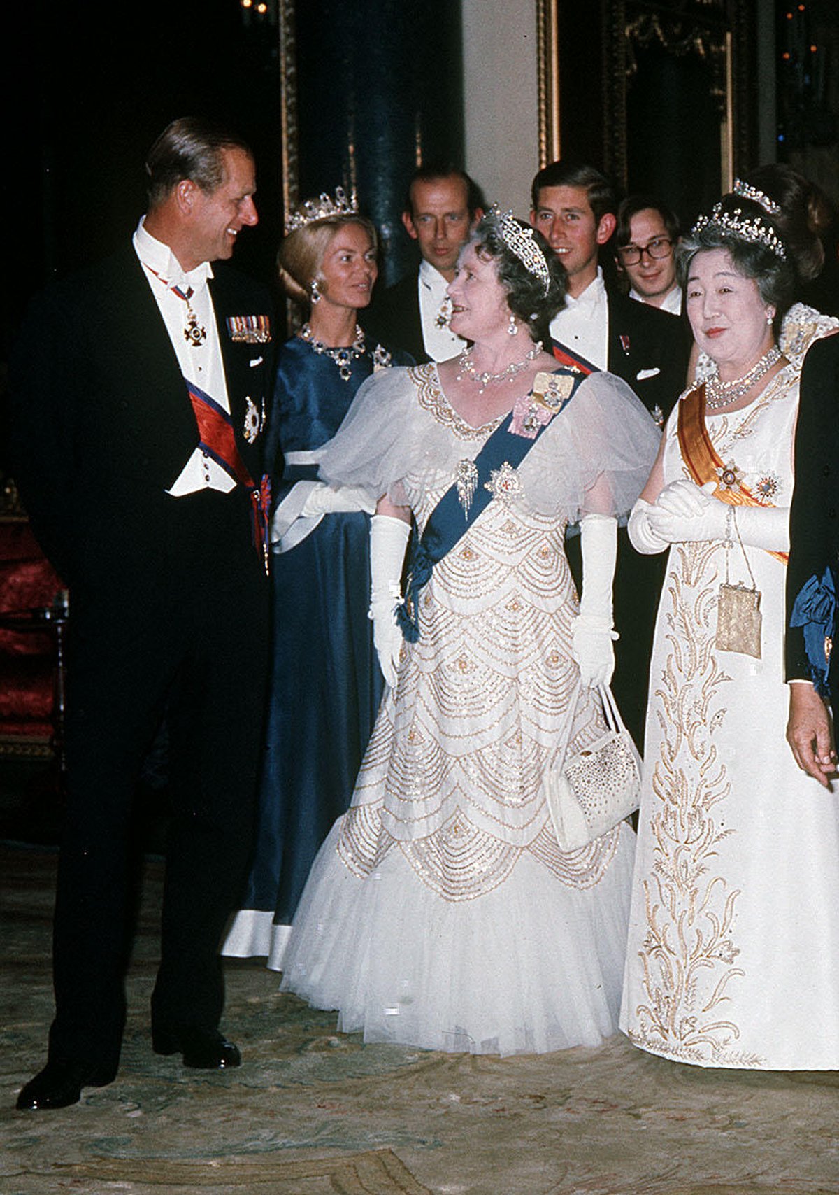 The Duke of Edinburgh, the Duchess of Kent, the Duke of Kent, the Queen Mother, the Prince of Wales, Prince Richard of Gloucester, and the Empress of Japan are pictured during a state banquet given in honor of the Emperor and Empress of Japan at Buckingham Palace in London on October 5, 1971 (PA Images/Alamy)