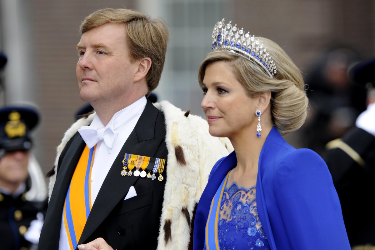 The King and Queen of the Netherlands depart after his inauguration at the inauguration at the Nieuwe Kerk in Amsterdam on April 30, 2013 (WENN/Alamy)
