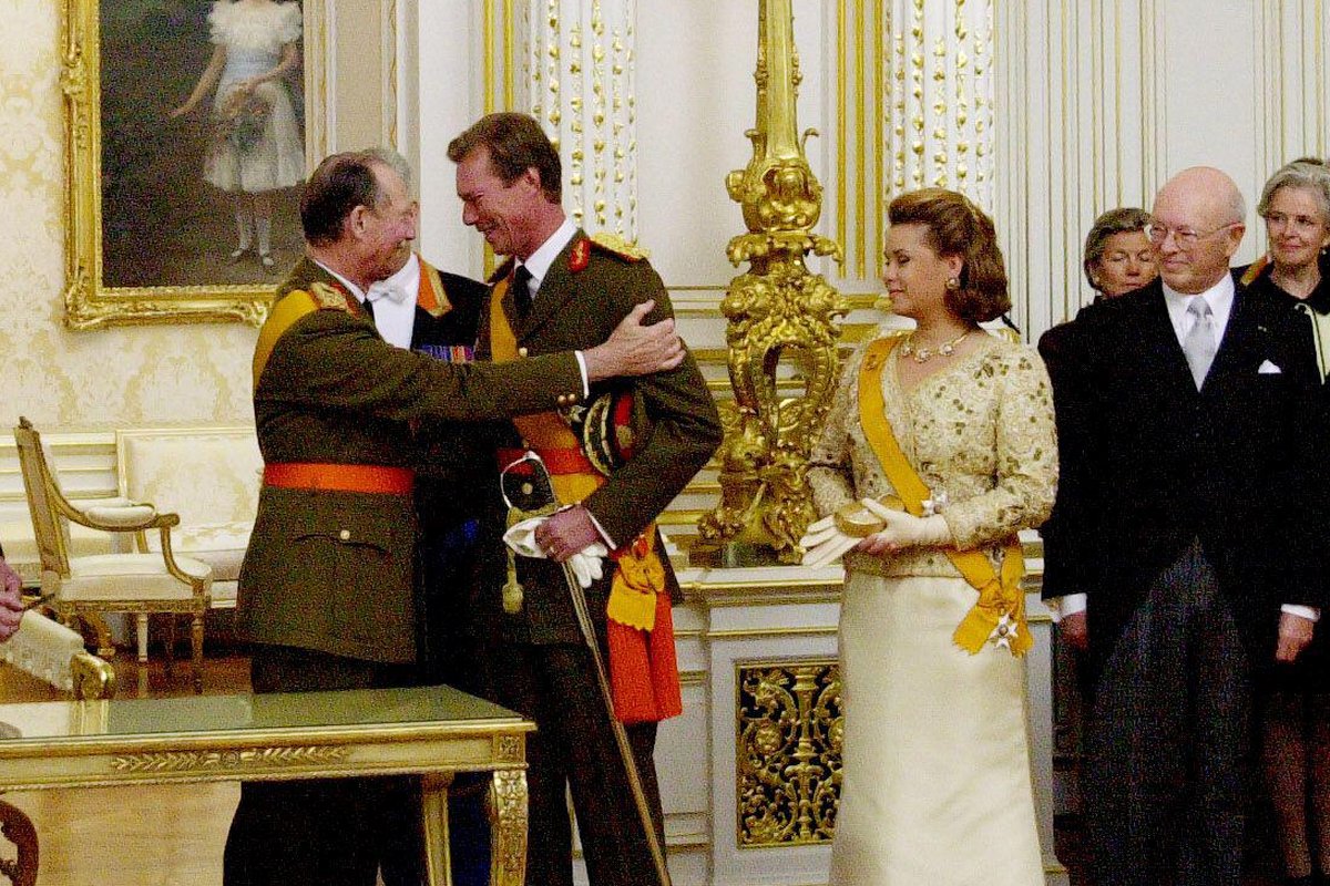Grand Duke Jean, Grand Duke Henri, and Grand Duchess Maria Teresa of Luxembourg are pictured during Jean's abdication ceremony on October 7, 2000 (Zuma Press/Alamy)