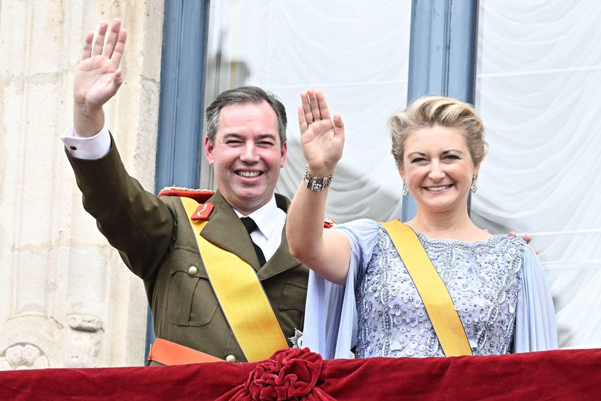 The Grand Duke and Grand Duchess of Luxembourg wave from the balcony of the Grand Ducal Palace on October 3, 2025 (David Niviere/Abaca Press/Alamy)