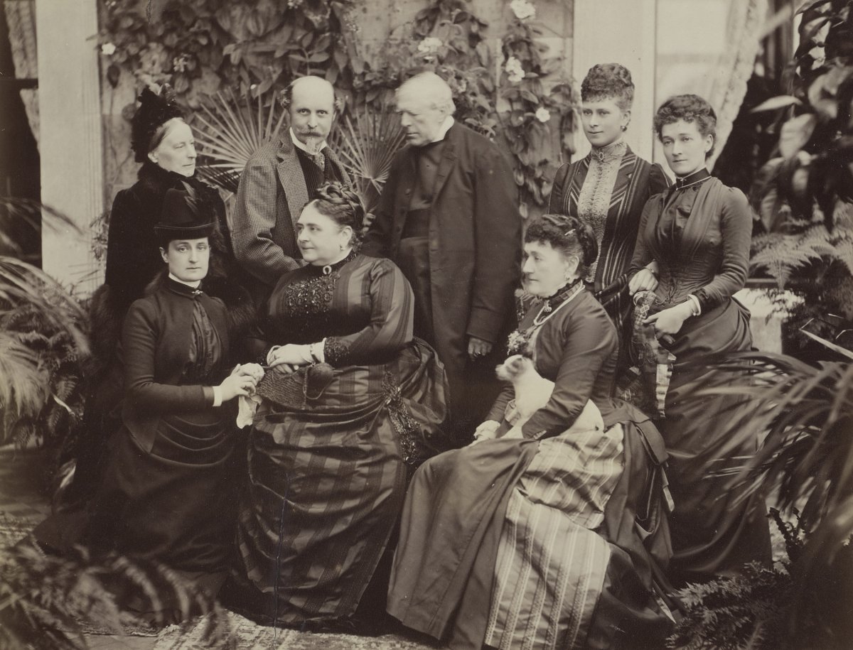 Christian de Falbe (second from top left) and Eleanor de Falbe (bottom right), host a group of guests, including the Duchess of Teck, Princess May of Teck, and the Bishop of St. Albans, at Luton Hoo in Buckinghamshire, November 1887 (Royal Collection Trust)