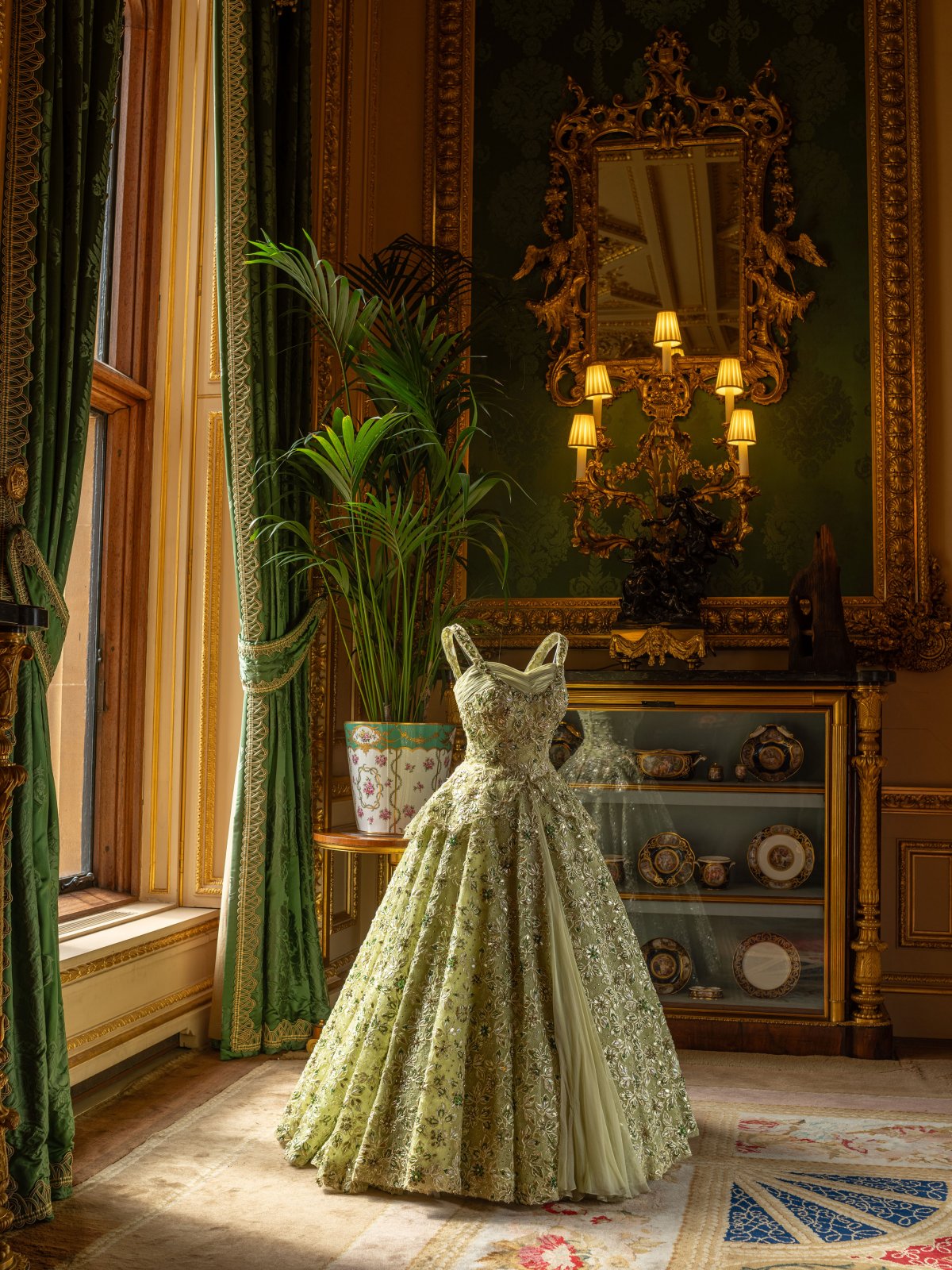 An evening gown made by Norman Hartnell for Queen Elizabeth II, displayed in the Green Drawing Room at Windsor Castle (Paul Bulley/Royal Collection Trust)