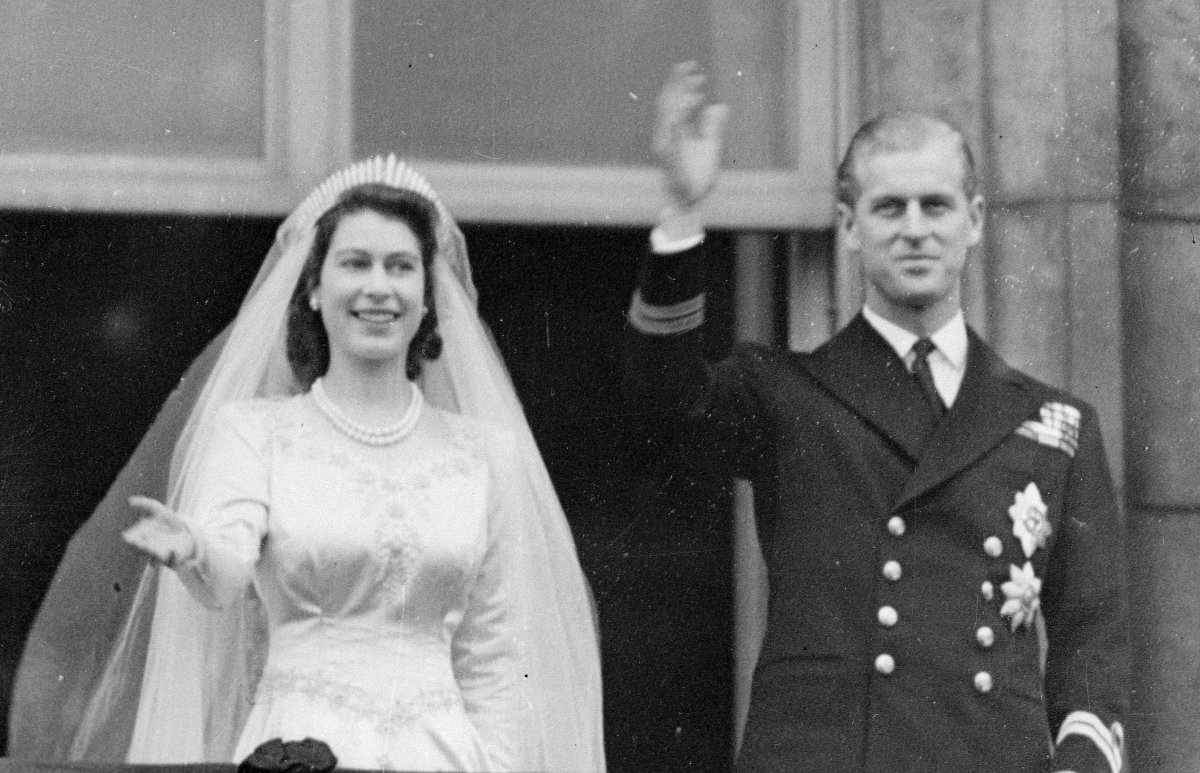 Princess Elizabeth and Prince Philip wave from the balcony of Buckingham Palace after their royal wedding on November 20, 1947 (Smith Archive/Alamy)