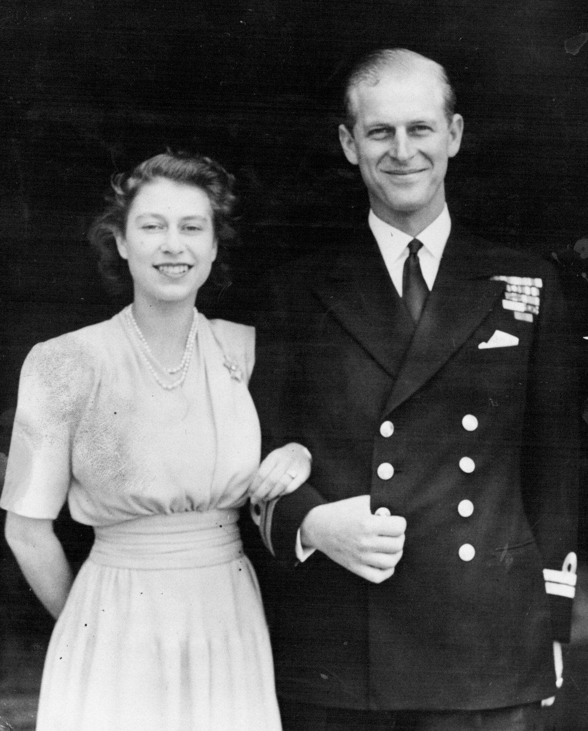 Princess Elizabeth and Lieutenant Philip Mountbatten pose for an official engagement portrait in July 1947 (SuperStock/Alamy)