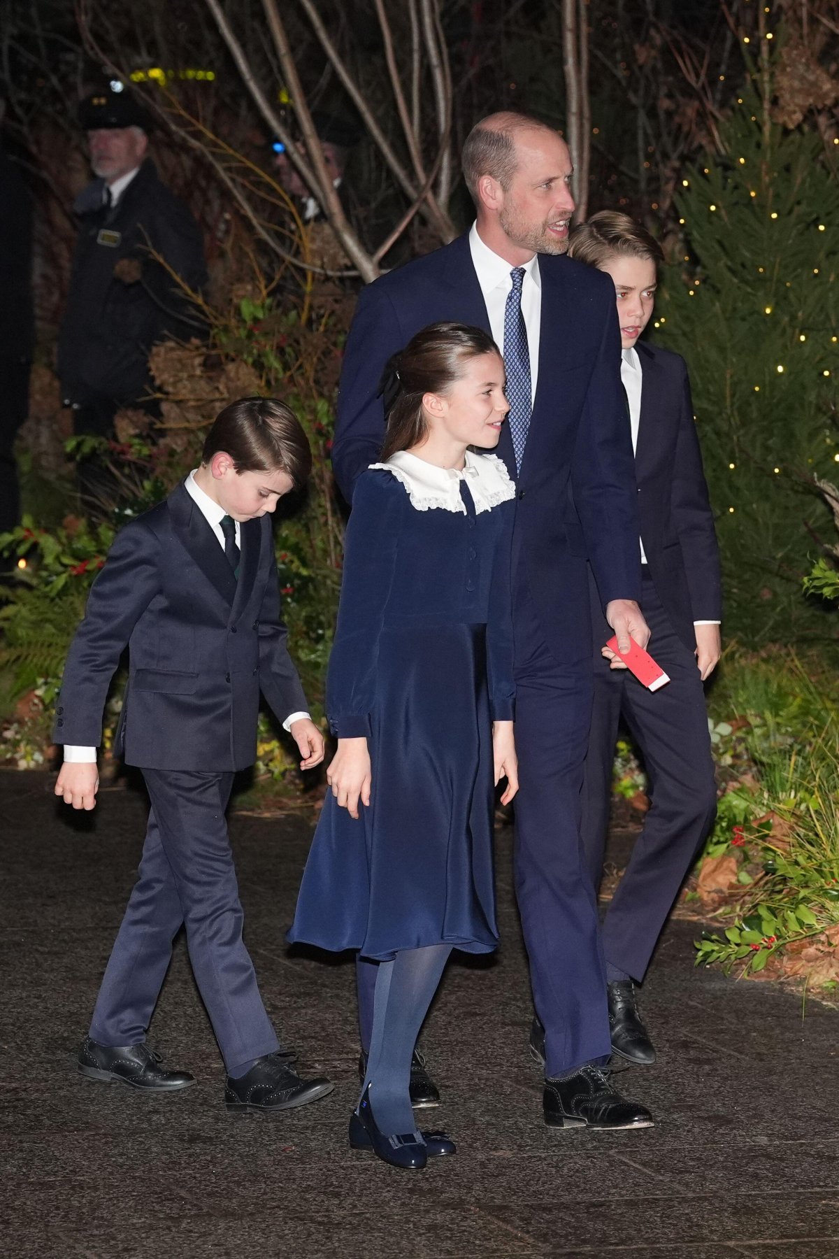 The Prince of Wales, with Prince George, Princess Charlotte, and Prince Louis, arrives for the Together at Christmas concert at Westminster Abbey in London on December 5, 2025 (Lucy North/PA Images/Alamy)