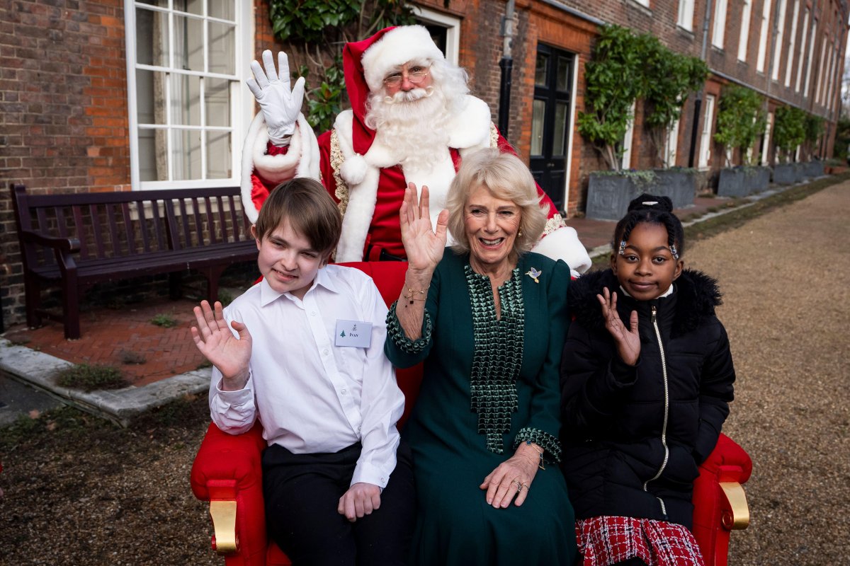 Queen Camilla hosts a Christmas tree decorating party for children from Helen and Douglas House and Roald Dahl's Marvellous Children's Charity at Clarence House in London on December 11, 2025 (Aaron Chown/PA Images/Alamy)