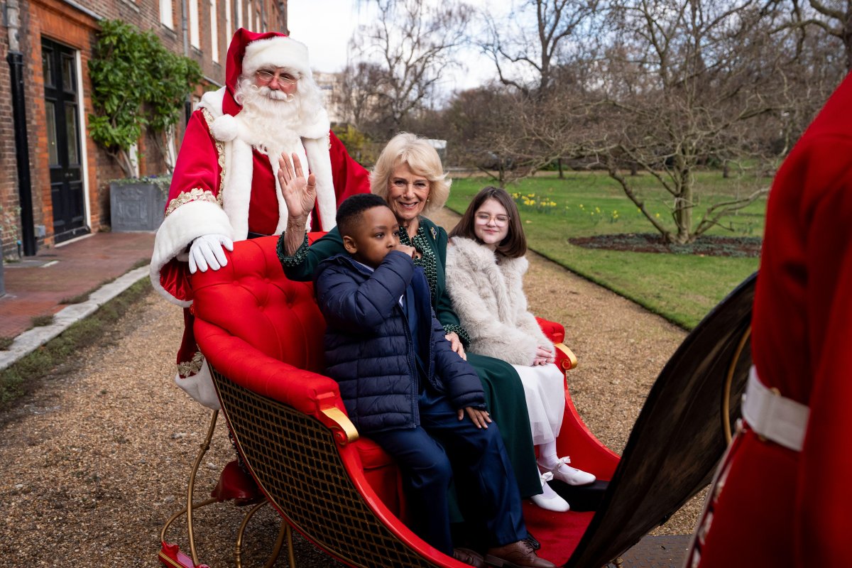 Queen Camilla hosts a Christmas tree decorating party for children from Helen and Douglas House and Roald Dahl's Marvellous Children's Charity at Clarence House in London on December 11, 2025 (Aaron Chown/PA Images/Alamy)