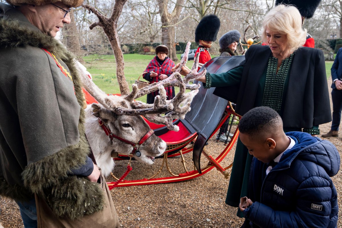 Queen Camilla hosts a Christmas tree decorating party for children from Helen and Douglas House and Roald Dahl's Marvellous Children's Charity at Clarence House in London on December 11, 2025 (Aaron Chown/PA Images/Alamy)