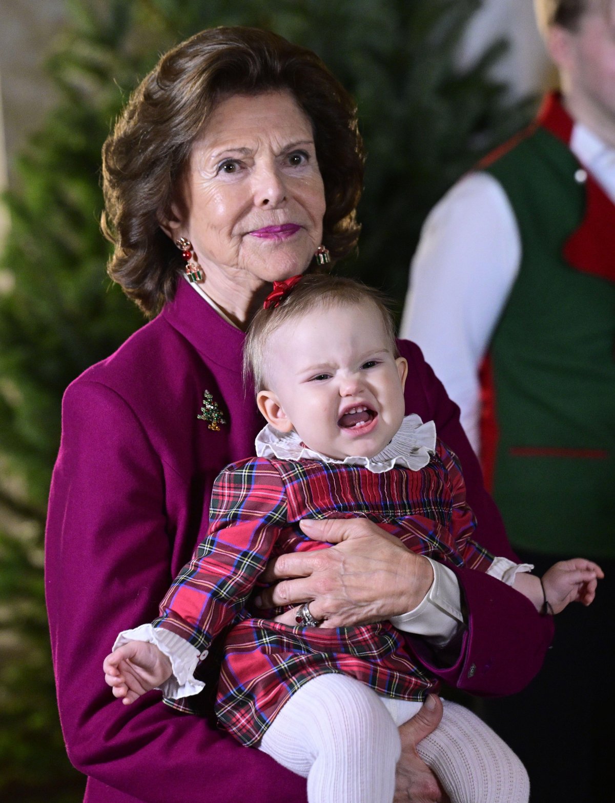 The Queen of Sweden and her grandchildren receive this year's Christmas trees at the Royal Palace in Stockholm on December 15, 2025 (Jonas Ekströmer/TT News Agency/Alamy)